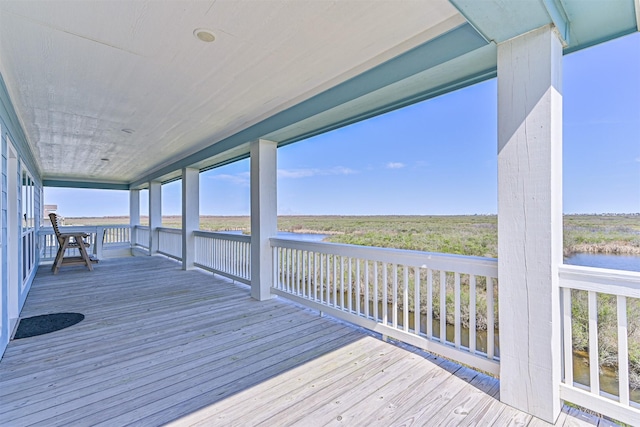 deck featuring a water view