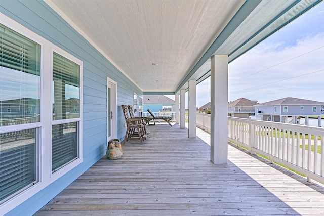 wooden terrace with a residential view