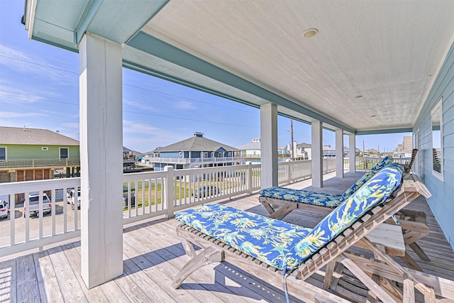 wooden deck with a residential view