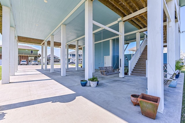 view of patio featuring stairway