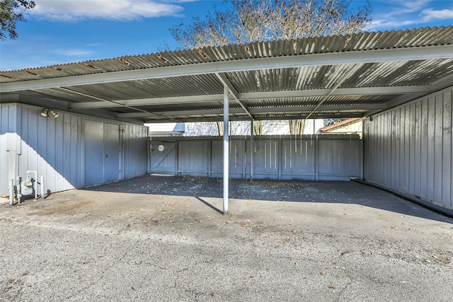 covered parking lot with fence