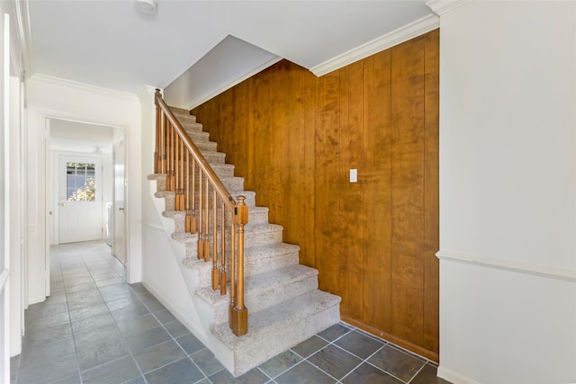 stairway featuring ornamental molding