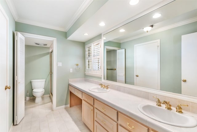 full bath featuring double vanity, visible vents, ornamental molding, and a sink