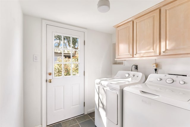 laundry room with separate washer and dryer, cabinet space, and baseboards