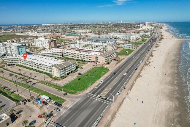 bird's eye view with a water view, a beach view, and a city view