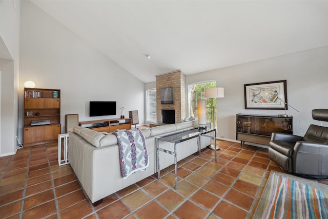 living room featuring baseboards, high vaulted ceiling, a fireplace, and tile patterned floors