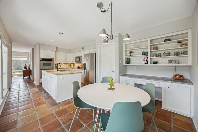 dining area featuring recessed lighting