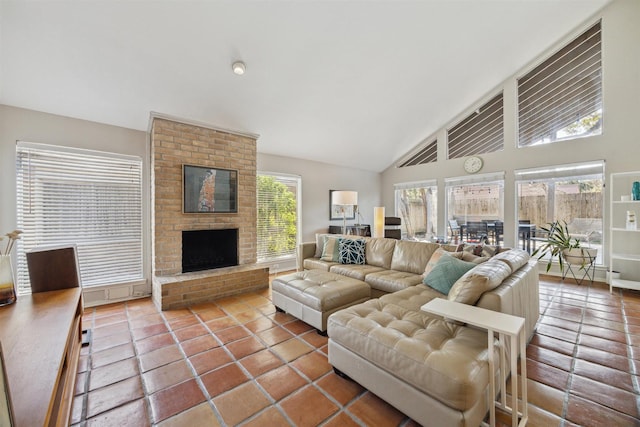 tiled living area with a fireplace and high vaulted ceiling