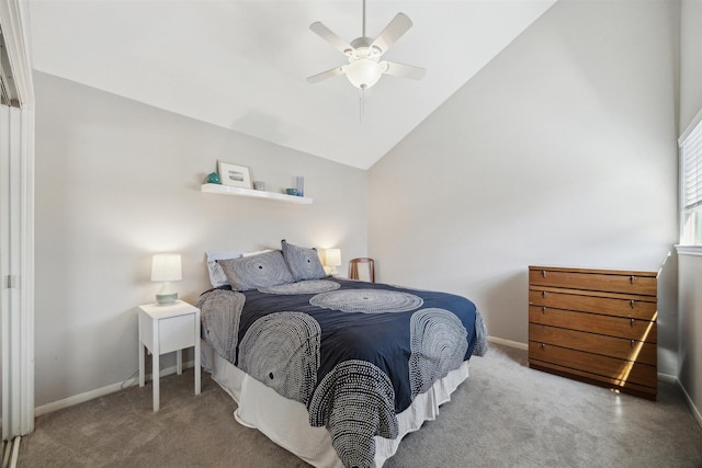 carpeted bedroom featuring lofted ceiling, baseboards, and a ceiling fan