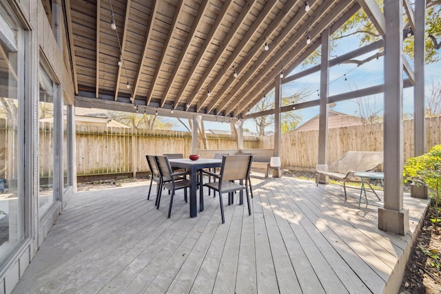 wooden deck featuring fence and outdoor dining space