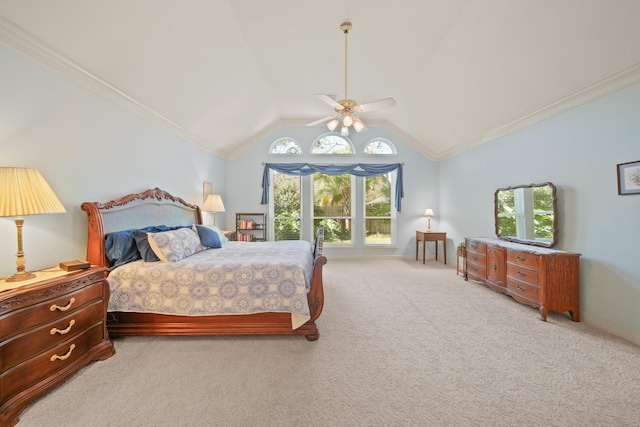 bedroom featuring baseboards, ceiling fan, light colored carpet, lofted ceiling, and ornamental molding