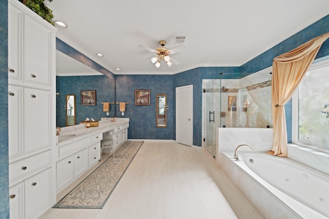 bathroom featuring a ceiling fan, a tub with jets, visible vents, double vanity, and a stall shower