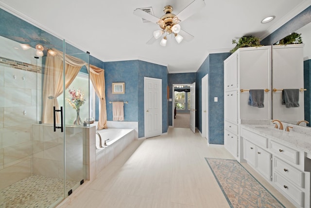 full bath with a wealth of natural light, a bath, a shower stall, and ornamental molding