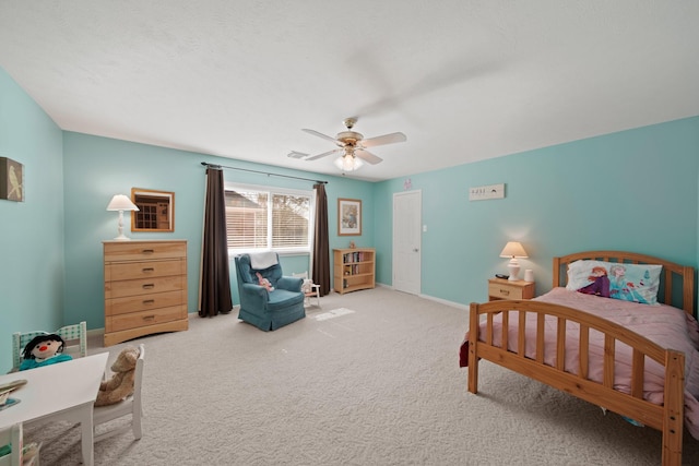 bedroom featuring visible vents, carpet floors, baseboards, and a ceiling fan