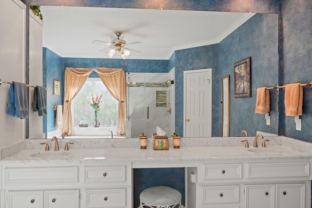 bathroom featuring a sink, a shower stall, crown molding, and double vanity