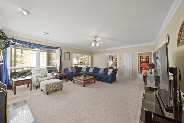 carpeted living room with visible vents, ceiling fan, and crown molding