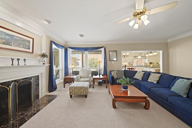 living area featuring visible vents, ceiling fan, carpet floors, ornamental molding, and a fireplace