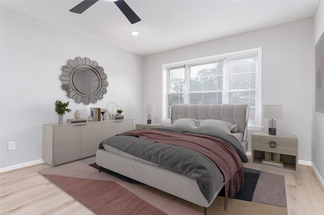 bedroom with recessed lighting, light wood-type flooring, a ceiling fan, and baseboards