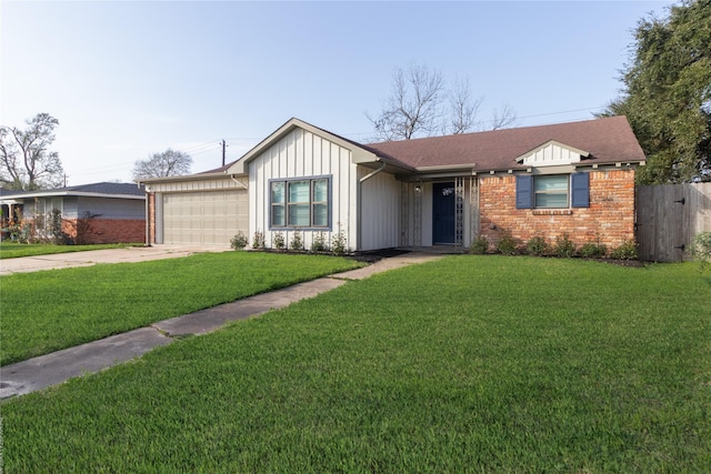 view of front of property with driveway, an attached garage, a front yard, and brick siding