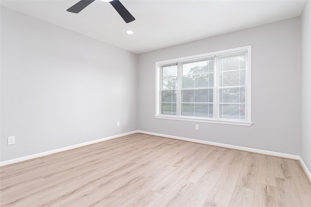 spare room with ceiling fan, light wood-style floors, recessed lighting, and baseboards