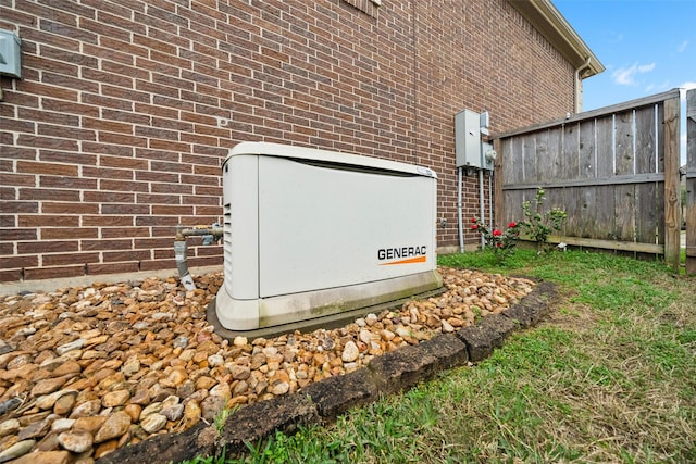 exterior details featuring a power unit, brick siding, and fence