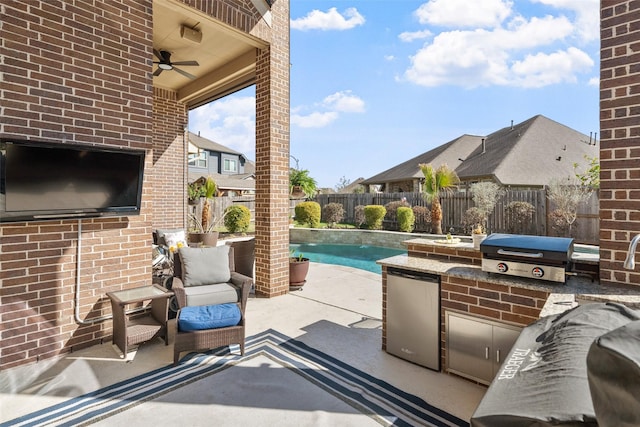 view of patio featuring a fenced backyard, a fenced in pool, a ceiling fan, and area for grilling