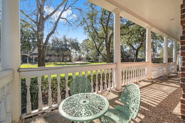 deck featuring a residential view and covered porch