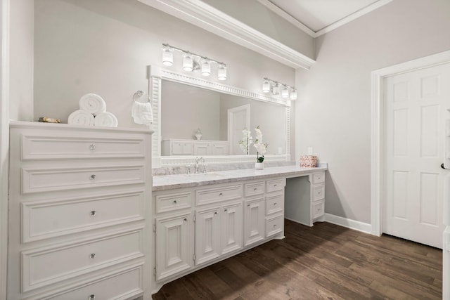 bathroom featuring ornamental molding, vanity, baseboards, and wood finished floors