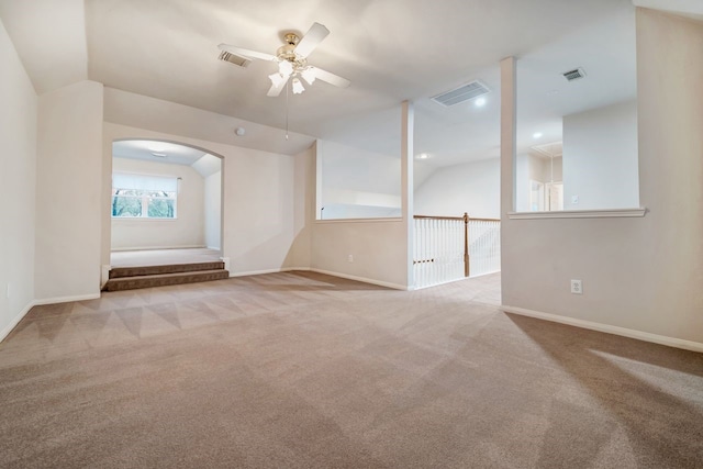 interior space featuring lofted ceiling, carpet floors, and visible vents