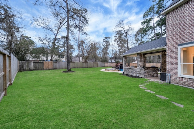 view of yard featuring a patio and a fenced backyard