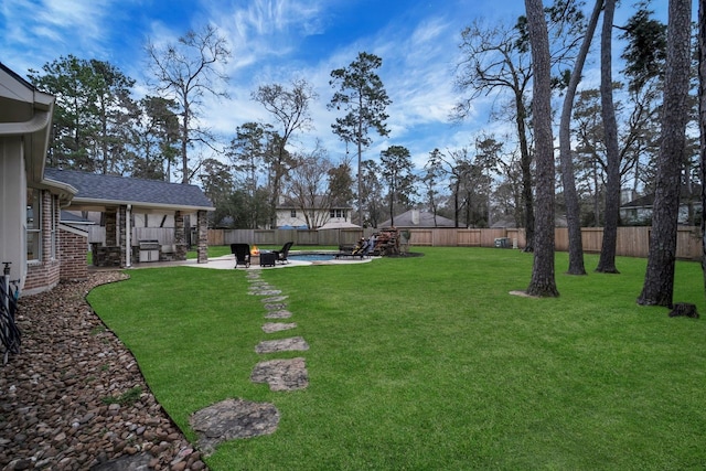 view of yard with a patio and a fenced backyard