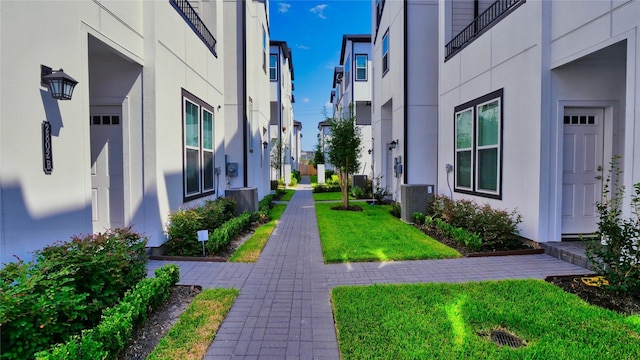 view of property's community with a lawn