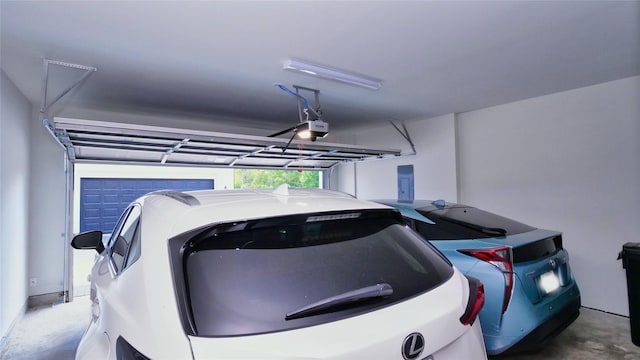 garage featuring washer / dryer and a garage door opener