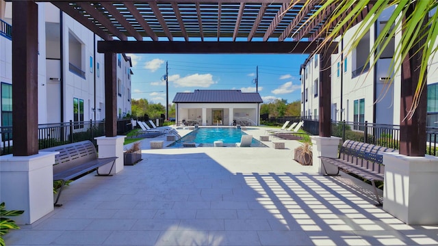 pool featuring a patio area, an exterior structure, an outdoor structure, and fence