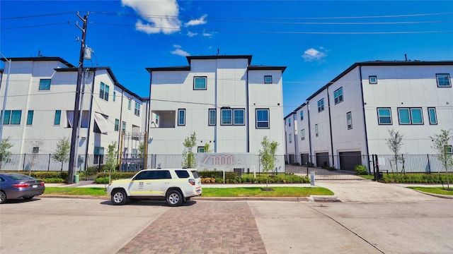 view of property with fence