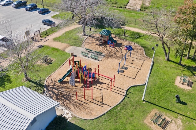 community playground with a lawn and fence