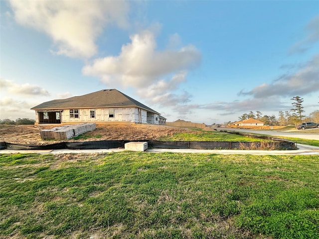 view of property exterior with a lawn