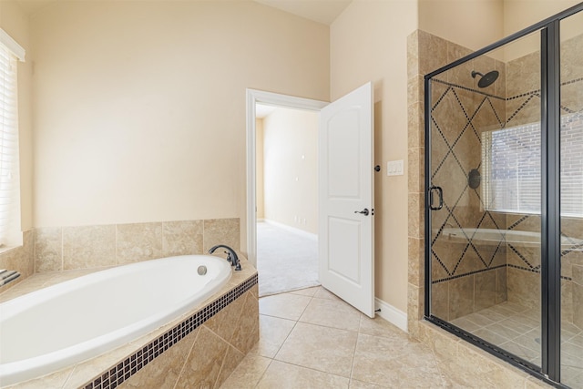 23403 Clark Arbor Ln, Katy, TX 77493 - full bathroom with a stall shower, plenty of natural light, a garden tub, and tile patterned floors