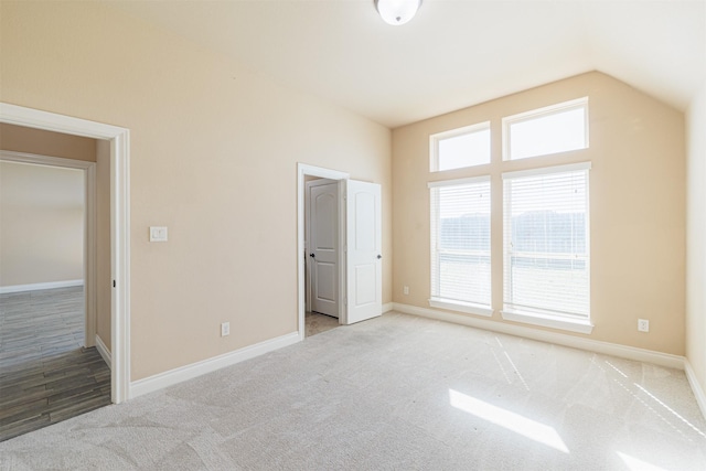 23403 Clark Arbor Ln, Katy, TX 77493 - unfurnished bedroom with carpet floors, baseboards, and vaulted ceiling