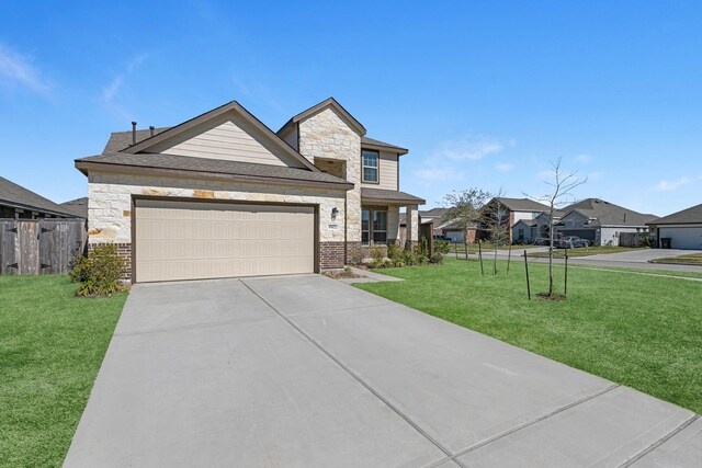 view of front facade featuring a garage, concrete driveway, stone siding, fence, and a front yard