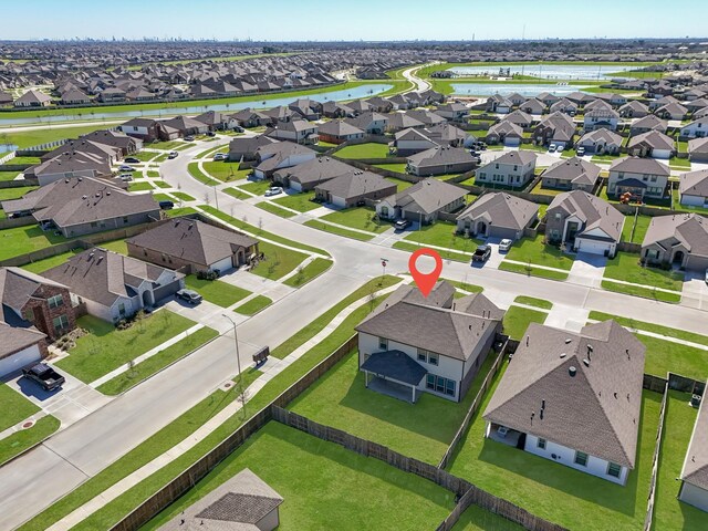 birds eye view of property with a residential view