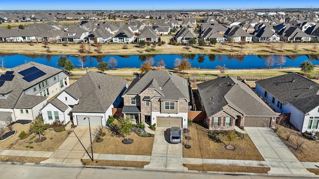 aerial view with a water view and a residential view