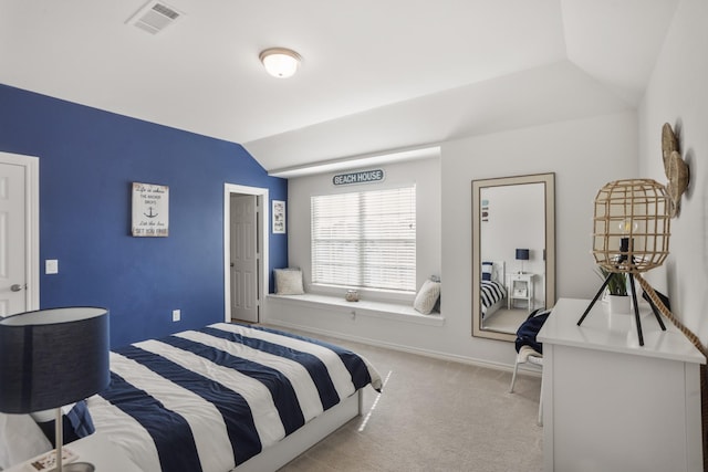 bedroom featuring lofted ceiling, baseboards, visible vents, and carpet