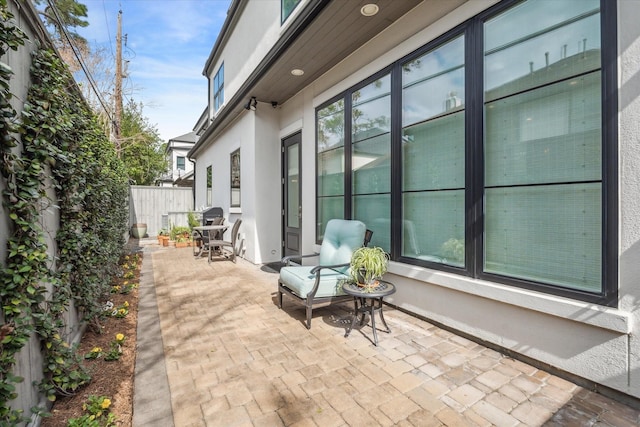 view of patio featuring fence