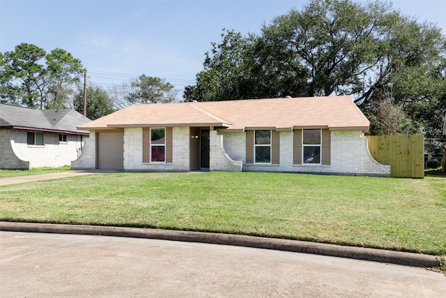 ranch-style house featuring an attached garage, brick siding, fence, concrete driveway, and a front yard