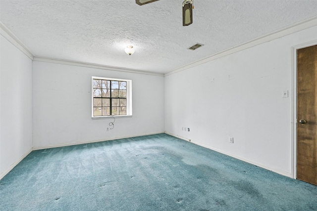 spare room with a textured ceiling, ceiling fan, carpet floors, visible vents, and crown molding