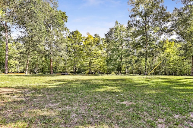 view of yard with a forest view