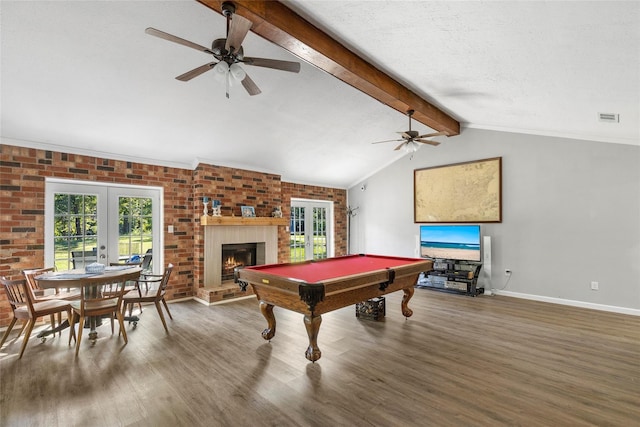 playroom with visible vents, lofted ceiling with beams, wood finished floors, french doors, and a fireplace