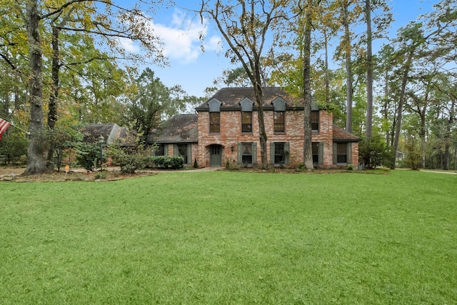 french country style house featuring a front lawn