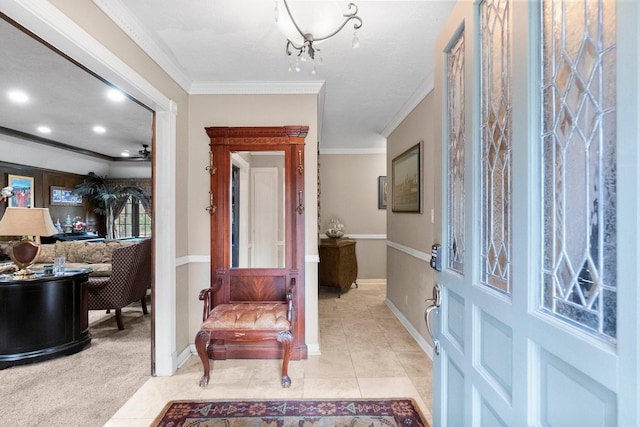 entryway with light tile patterned flooring, a notable chandelier, light carpet, baseboards, and crown molding